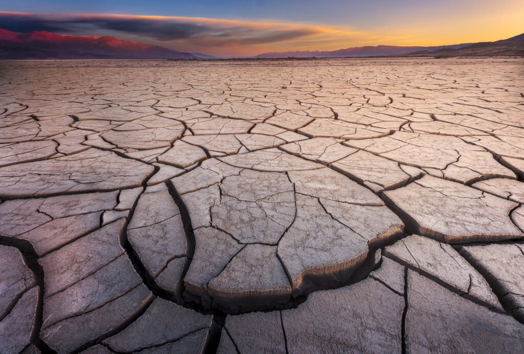 Desolate mud flat basin in Death Valley, CA - Adobe Stock photo