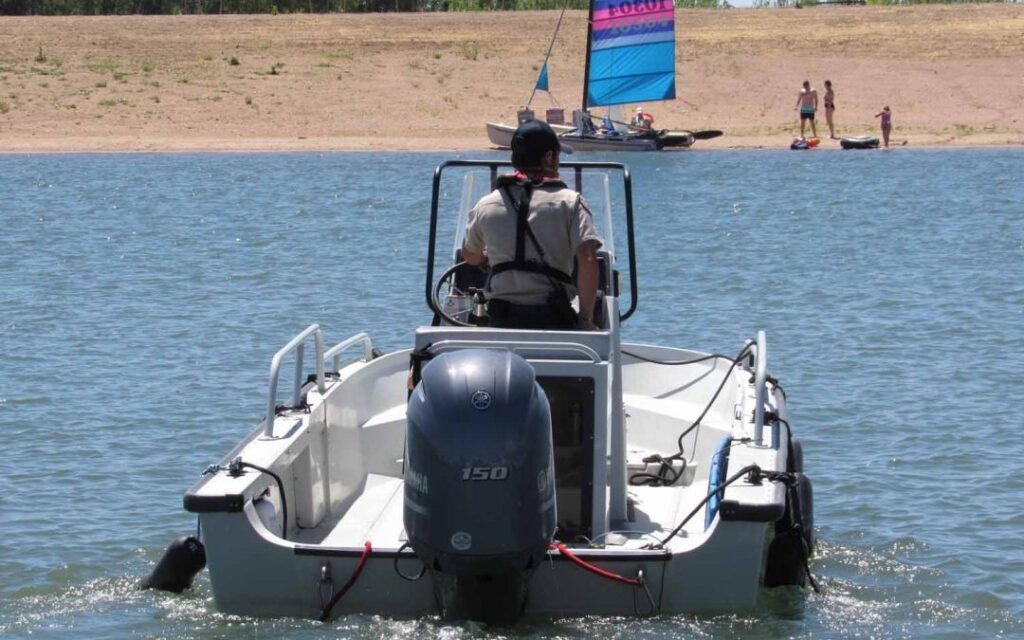 A Colorado Parks and Wildlife officer heads out on patrol at Chatfield Reservoir. A $171 million redesign at the popular lake is now complete, providing more water storage for Front Range cities and farmers. But environmental concerns remain about the project's impact on hundreds of bird species. June 8, 2020 Credit: Jerd Smith