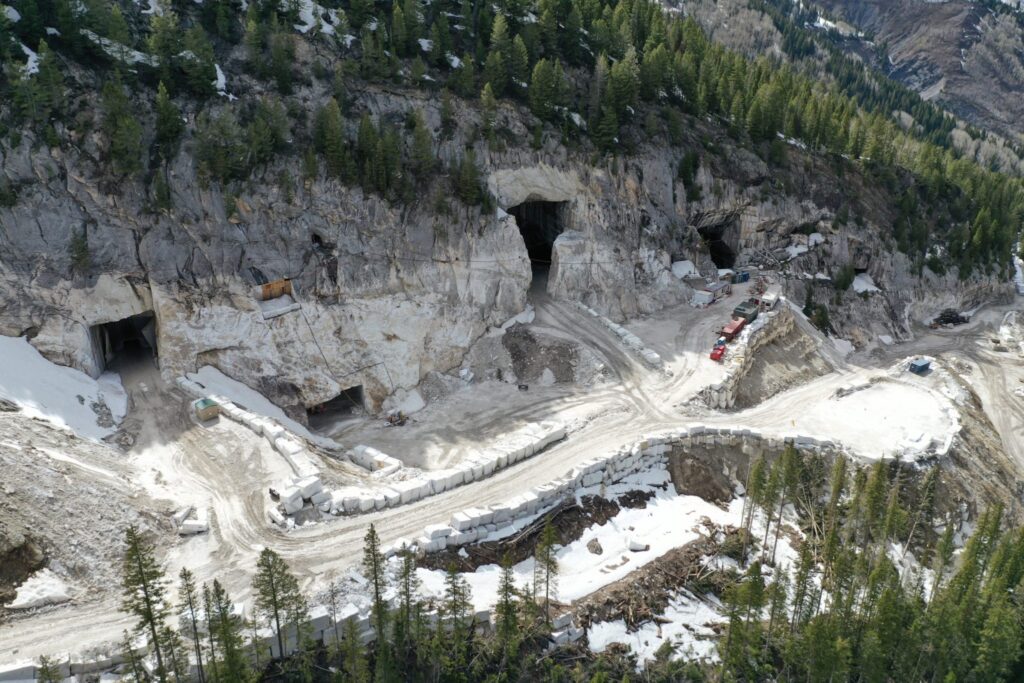 Portals to the marble galleries of the Pride of America Mine can be seen in this still photo from drone footage. Quarry operators Colorado Stone Quarries relocated Yule Creek in 2018 to build an access road.