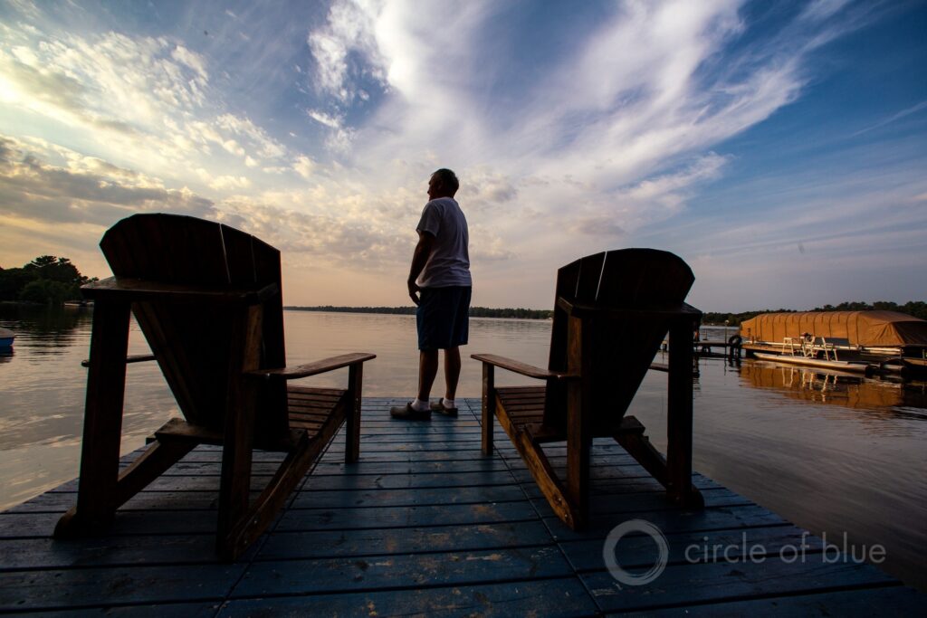 Greg Cole gazes at Van Etten Lake, a waterbody in northeastern Michigan that has been polluted with PFAS compounds from the former Wurtsmith Air Force Base. Photo © J. Carl Ganter/Circle of Blue