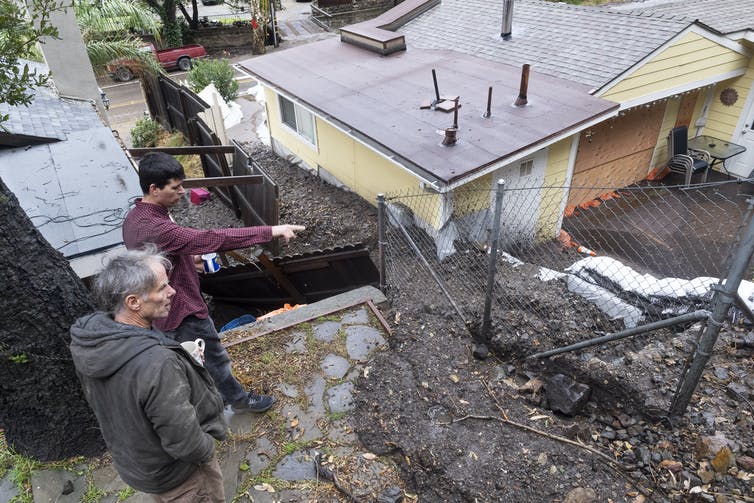 A 2021 rainstorm that hit the denuded landscape of a burn scar sent mud flowing into streets and yards in Silverado, California. Paul Bersebach/MediaNews Group/Orange County Register via Getty Images