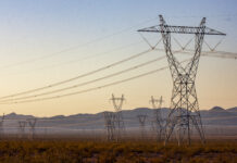 Transmission lines march outward from Hoover Dam, delivering the dam's hydroelectric power to cities, irrigation districts, and tribes across the Southwest.