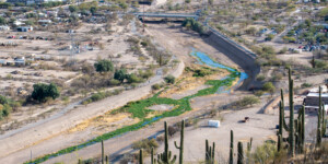 Once a ribbon of life flowing north from Mexico, the Santa Cruz River is now largely dry as it runs through Tucson, Arizona. ©Ted Wood Usage rights are granted for editorial and nonprofit purposes only. No commercial or re-sale rights are granted without permission of the photographer.