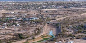 Once a ribbon of life flowing north from Mexico, the Santa Cruz River is now largely dry as it runs through Tucson, Arizona. ©Ted Wood Usage rights are granted for editorial and nonprofit purposes only. No commercial or re-sale rights are granted without permission of the photographer.
