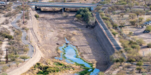Once a ribbon of life flowing north from Mexico, the Santa Cruz River is now largely dry as it runs through Tucson, Arizona. ©Ted Wood Usage rights are granted for editorial and nonprofit purposes only. No commercial or re-sale rights are granted without permission of the photographer.