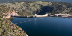 Flaming Gorge Reservoir stores water from the Green River in Wyoming, and is shared by Wyoming and Utah. The Green River leaves the dam at Dutch John, UT and joins the Colorado River south in Canyonlands NP.