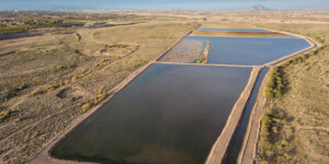 Excess water from the Salt and Verde rivers, Central Arizona Project water via the South Canal, and reclaimed water via pipeline from Mesa water reclamation facility is diverted to storage ponds (basins) at the Granite Reef Underground Storage Project. The project is a partnership between Phoenix and 5 other regional municipalities. It is owned and operated by Salt River Project (SRP).
Through artificial groundwater recharge, water is retained in huge, porous earthen basins and allowed to seep into the natural underground aquifer below. Water is stored in the aquifer and withdrawn by well-pumping when needed.
GRUSP and NAUSP enable Arizona to maximize the use of its Colorado River entitlement and help the state reach its "safe yield" goal. Safe yield is the equilibrium between the amount of groundwater pumped from an aquifer and the amount recharged into it.
It is permitted to recharge 93,000 acre-feet per year.