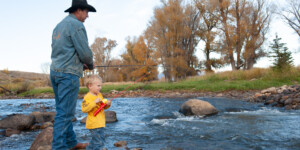 A father and son fish in the Upper Colorado River near Windy Gap Reservoir, CO.