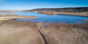 Lyman Lake, AZ, stores water from the Little Colorado River near its headwaters for use by downstream farmers and the Zuni Tribe.  In 2021, the lake is 30 ft. below full. The Little Colorado enters the lake as a tiny stream.