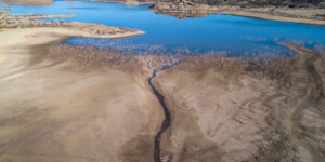 Lyman Lake, AZ, stores water from the Little Colorado River near its headwaters for use by downstream farmers and the Zuni Tribe. In 2021, the lake is 30 ft. below full. The Little Colorado enters the lake as a tiny stream.