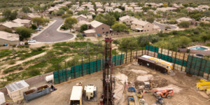 The water well being drilled in the Desert Ridge neighborhood of North Phoenix is 1,540 ft. deep.  It’s an aquifer storage and recovery well. It can store water and pull water back out, 3,000 gallons per minute.  It can support about 10,000 homes.  It will be 2 years before they pump water.  In times of excess water, Phoenix water can pump water into the aquifer for storage and pull water out when they need the water.  All North Phoenix neighborhoods are served by the CAP canal.
The purpose of the Program is to ensure adequate access to groundwater during future surface water restrictions, meet peak and future demands, manage system outages, and provide operational flexibility. Phase 1 of the Program includes the drilling and equipping of 10 wells, 7 aquifer storage and recovery wells and 3 water production wells.   All the wells serve areas currently being served by the CAP canal.
